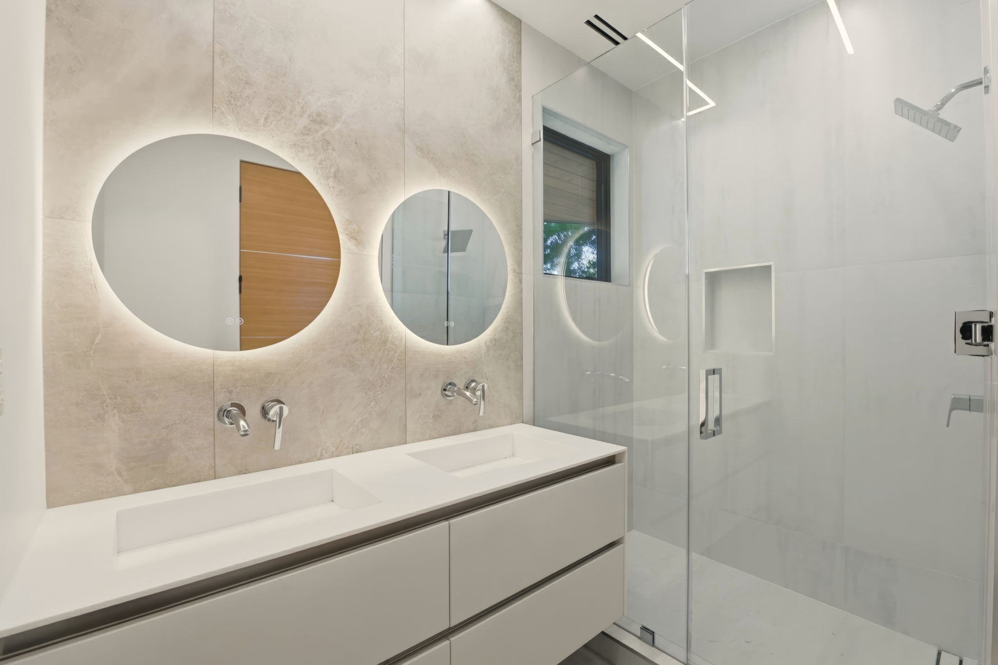 Grohe fixtures, dual backlit mirrors, frameless glass